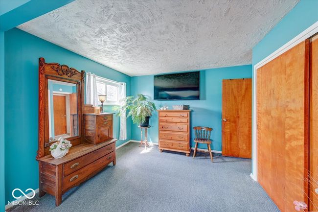extended master bedroom gives potential for an office space, small work out area, or a seating area | Image 27