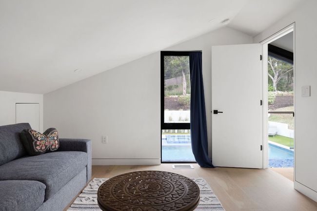 Living room with vaulted ceiling and light wood-type flooring | Image 25