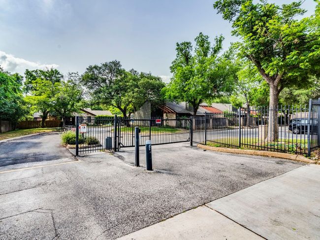 View of front of house featuring a residential view and a gate | Image 16