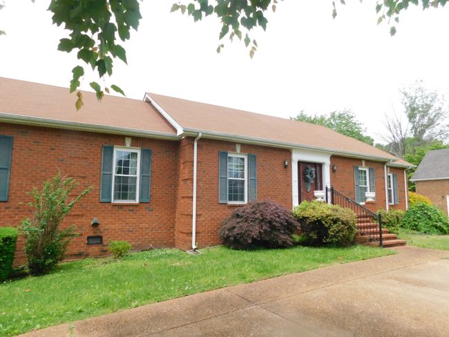 Enhanced Paved Parking, Front and Rear, Roof appears in Good Condition, Ready for the Next happy buyer | Image 6
