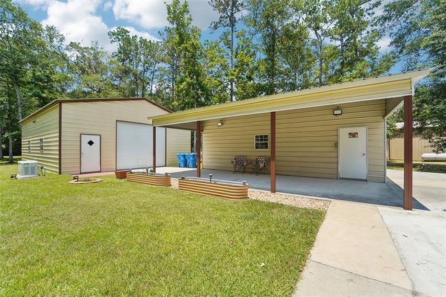 2 workshops plus a carport area as well as an RV pad (or extra driveway parking)! | Image 43