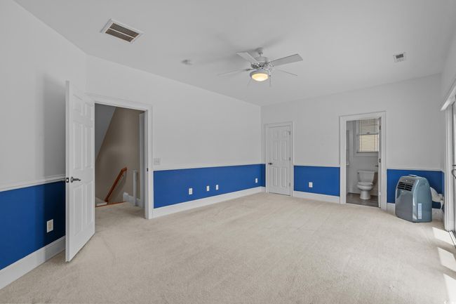 Unfurnished room featuring carpet flooring, a ceiling fan, and a smoke detector | Image 31