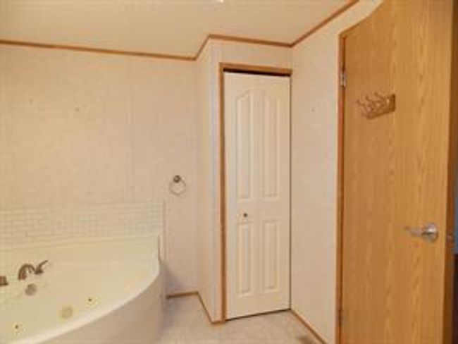 77 - 5210 65 Ave, Home with 3 bedrooms, 2 bathrooms and 3 parking in Olds AB | Image 21