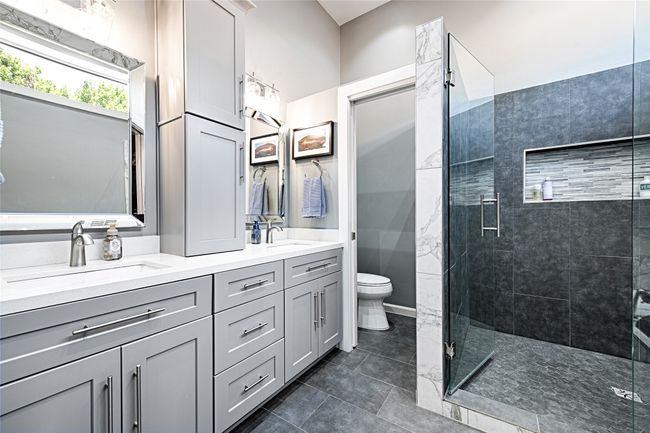 Exquisitely updated primary bathroom | Image 13