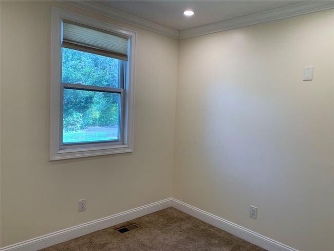 Cozy den or home office on first floor. | Image 16