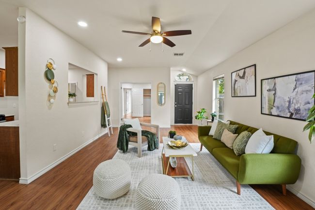 Open layout flows easily into the kitchen and dining area. 9349 Bernoulli Dr., Austin, TX 78748 | Image 5