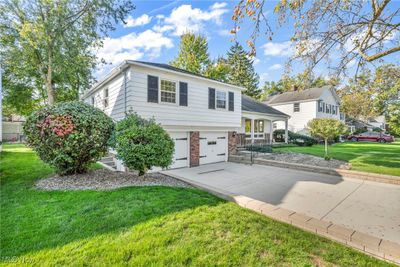 View of front of house with a garage and a front yard | Image 3