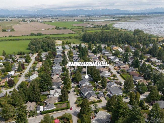 Aerial view of prime section of Beach Grove with a mountainous background, Beach Grove Elementary School at the end of the block, and the ocean just 4 short blocks east. | Image 5