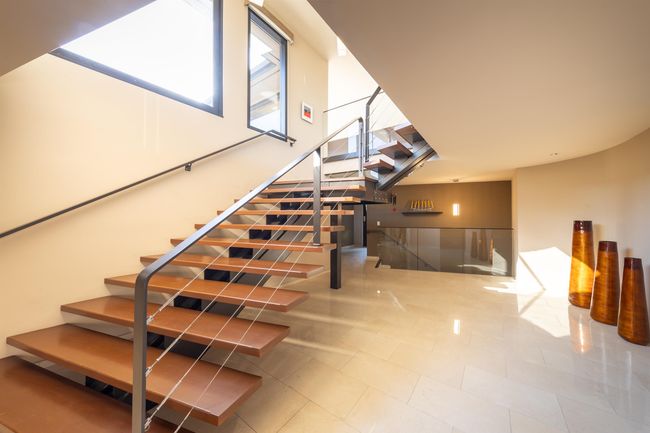 Stairs featuring tile patterned floors | Image 31