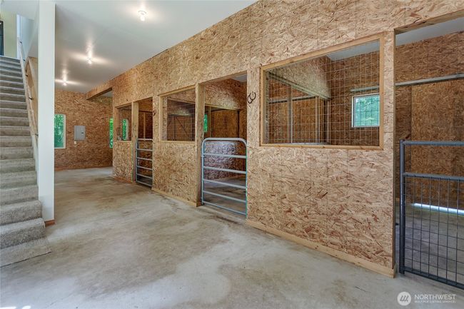 Refreshed barn with 3 stalls. Stairs lead to living quarters. | Image 22