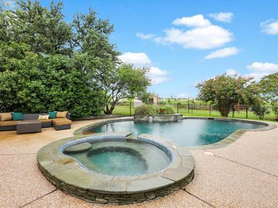 he centerpiece of this outdoor paradise is the Texas-sized in-ground pool, a refreshing oasis that will make those hot summer days something to look forward to. | Image 3