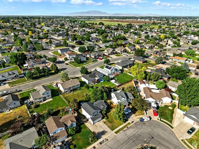 Aerial view of property's location featuring nearby suburban area and a mountain backdrop | Image 29