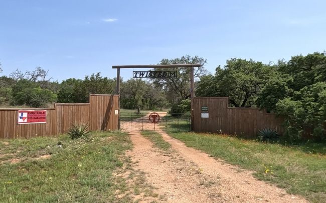 View of yard featuring fence and dirt driveway | Image 36