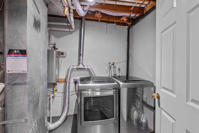 Laundry area featuring independent washer and dryer | Image 17