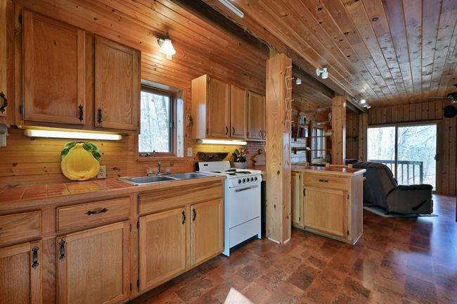 The kitchen has great storage and an electric stove. | Image 68