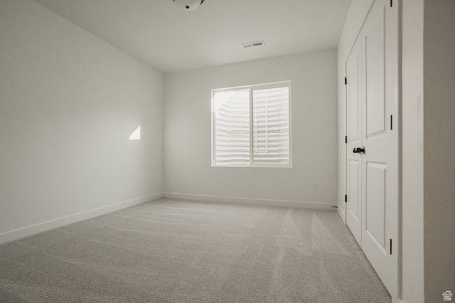 Unfurnished room featuring baseboards and light carpet | Image 44