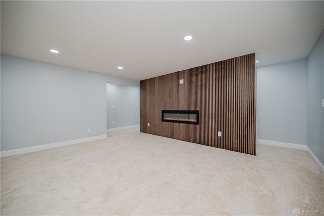 Fireplace wall with hallway on either side | Image 45