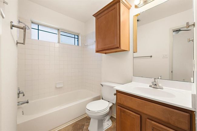 A clean and contemporary primary bathroom, ideal for your personal retreat. | Image 14