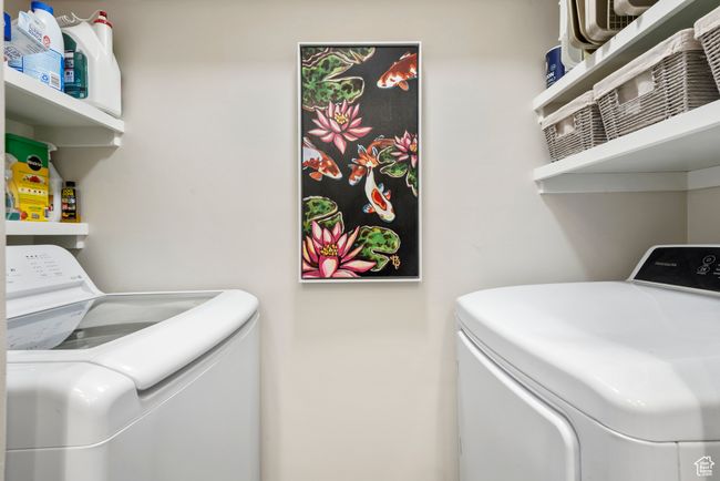 Laundry area with washing machine and clothes dryer | Image 17
