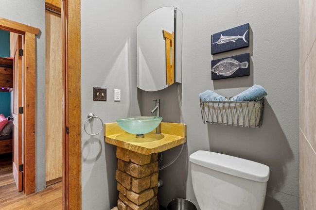 Bathroom featuring toilet, wood finished floors, and a sink | Image 33