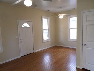 Entryway featuring ceiling fan and dark hardwood / wood-style floors | Image 3