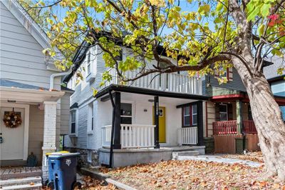 View of front of house featuring a porch and a balcony | Image 3