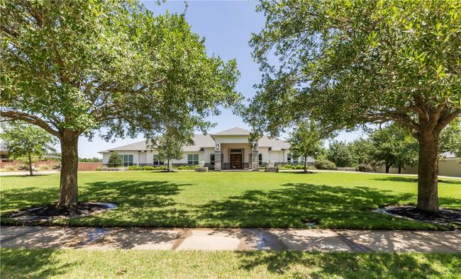View of front of house featuring stucco siding and a front lawn | Image 5