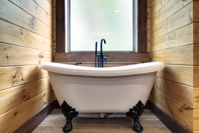 Soaking clawfoot tub in primary bathroom along with walk-in shower | Image 3