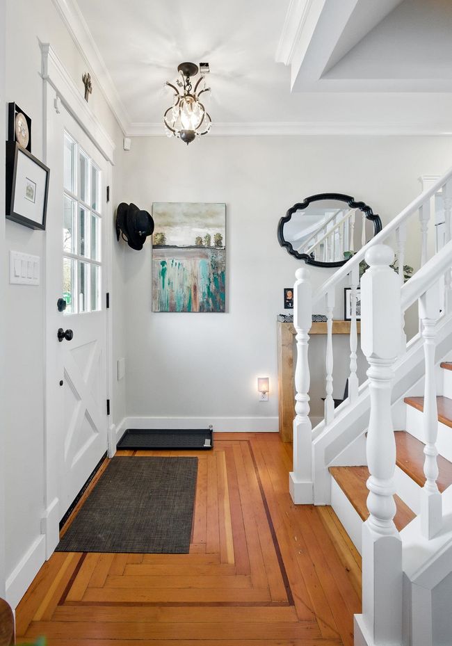 Foyer with stairway, crown molding, baseboards, and hardwood / wood-style flooring | Image 4