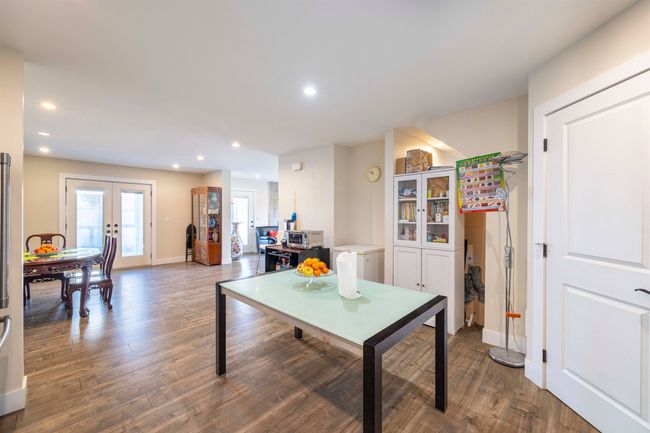 Dining room with recessed lighting, french doors, baseboards, and dark wood-type flooring | Image 11