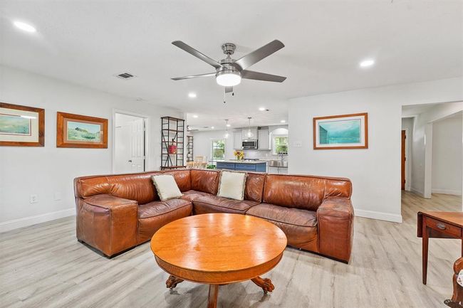 Open-concept living room that seamlessly flows into the kitchen—creating the perfect layout for hosting, and gathering. | Image 5