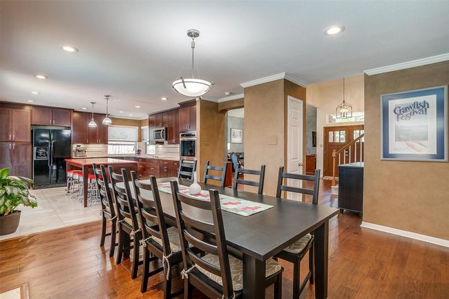 Dining Area or Optional Den with Wood Burning Fireplace | Image 15
