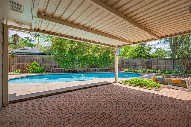 Wonderful covered patio off the back of the home. | Image 36