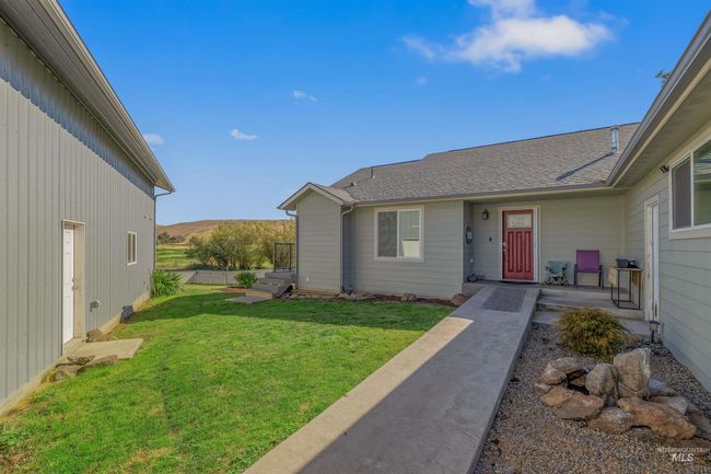View of exterior entry with a yard and a mountain view | Image 29