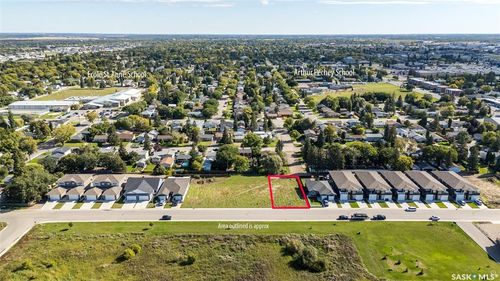 Expansive residential lot with surrounding urban landscape | Card Image