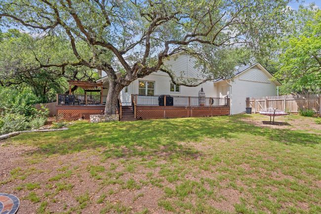 View of yard featuring a wooden deck | Image 37