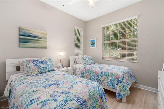 Bedroom featuring ceiling fan and light wood-type flooring | Image 17