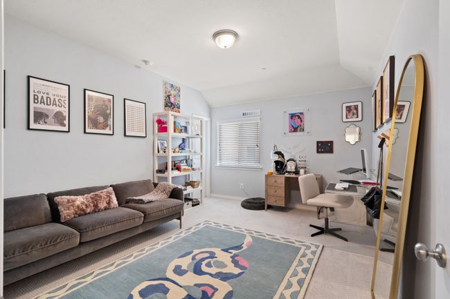 Carpeted office space with vaulted ceiling and baseboards | Image 20