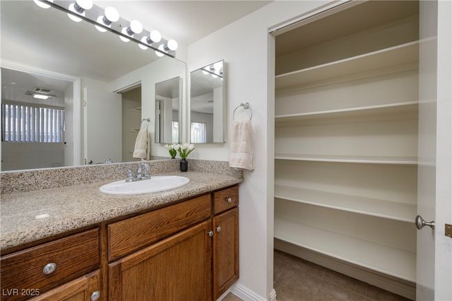 Bathroom featuring vanity and tile patterned flooring | Image 11