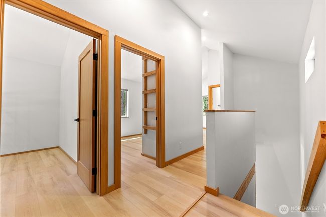 At top of stairs you can see the landing and entrance to mirror image upstairs bedrooms. | Image 29