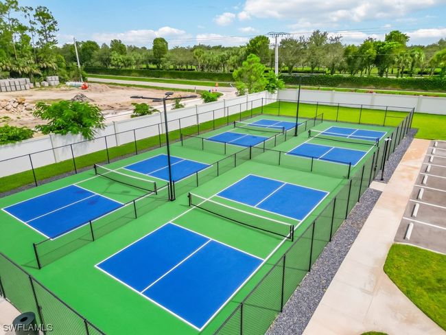 Discover the vibrant heart of leisure at the Community Clubhouse - the exhilarating pickleball courts, where you can engage in friendly matches surrounded by camaraderie and the joy of active living! | Image 30