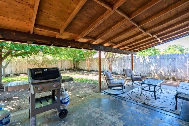 Fenced backyard featuring a patio and a grill | Image 26