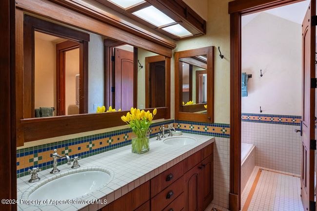 Bunk bath has both a tub and shower. Not shown, a stacked washer/dryer. Easy to keep kids and their clothes clean every day. | Image 44