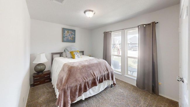 Carpeted bedroom with baseboards | Image 9