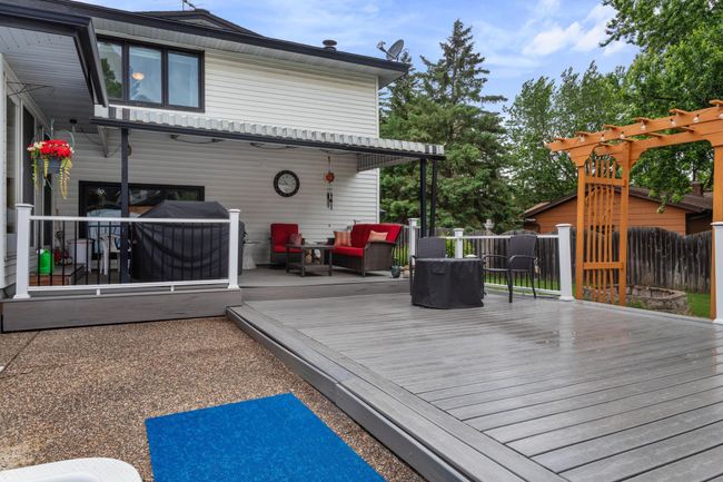 Want a break from the sun? Relax on the maintenance free covered deck | Image 8