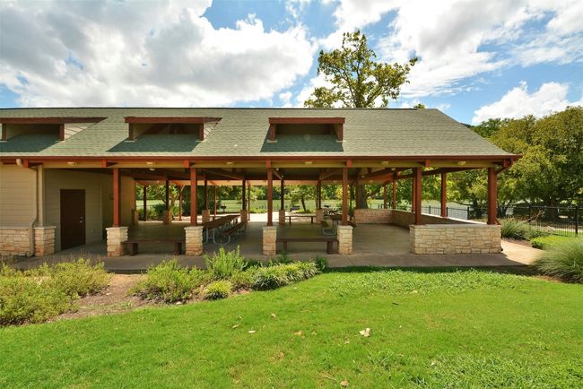View of property's community featuring a lawn and fence | Image 35