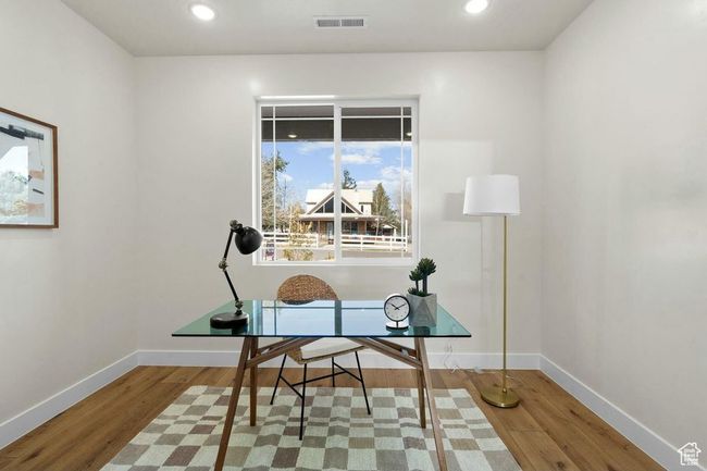 Home office featuring recessed lighting, wood finished floors, visible vents, and baseboards | Image 13