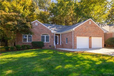 View of front of property with a front yard and a garage | Image 2