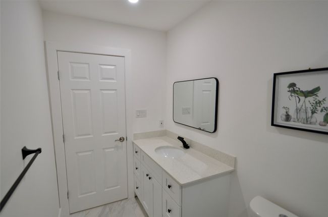 Half bathroom featuring vanity and toilet | Image 7