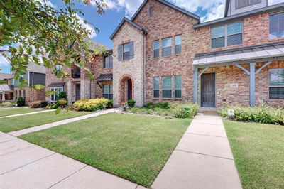 View of front facade with a front yard | Image 1